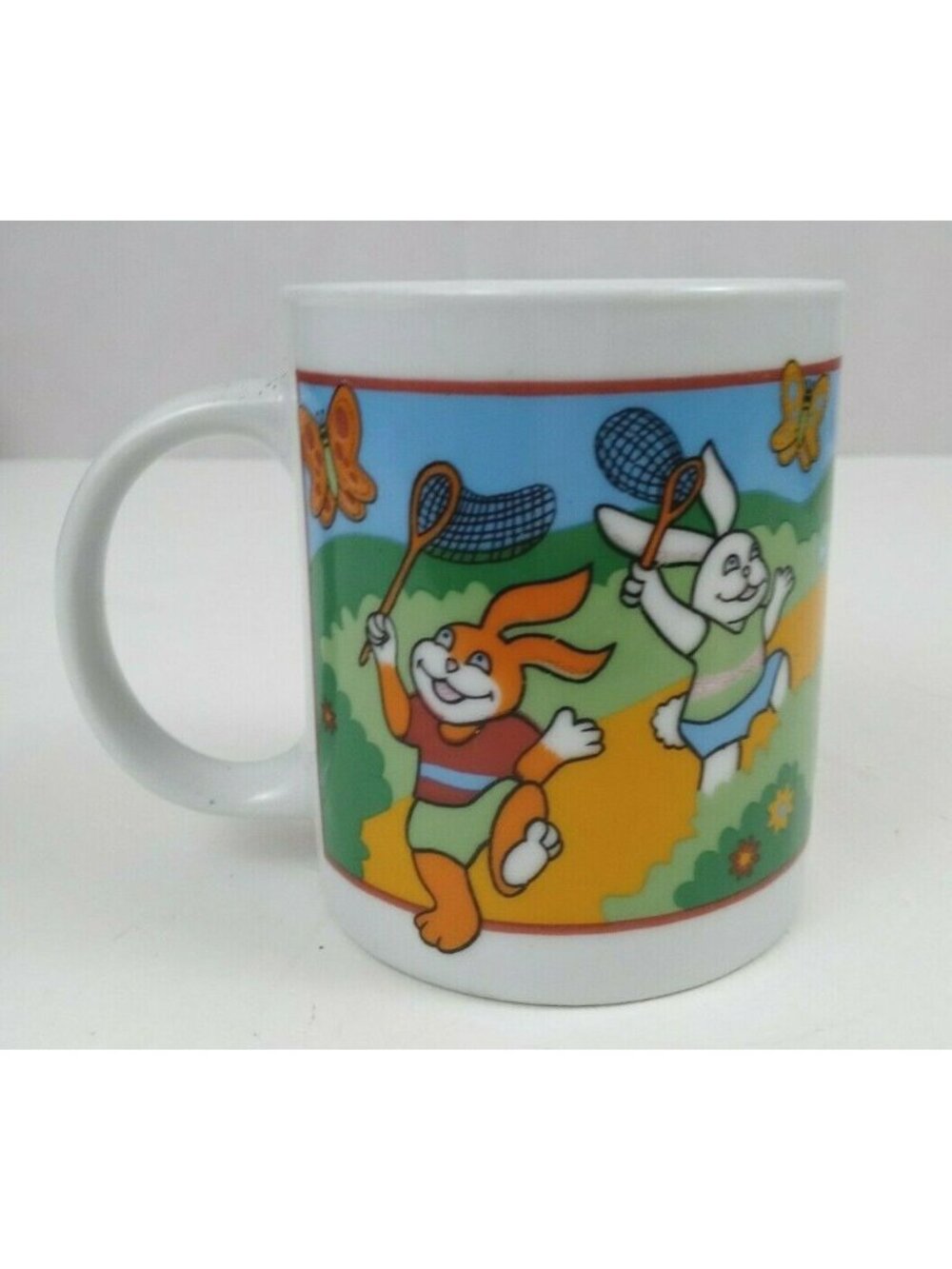 Vintage Easter Bunny Catching Butterflies Coffee Mug Cup 3.75" Tall